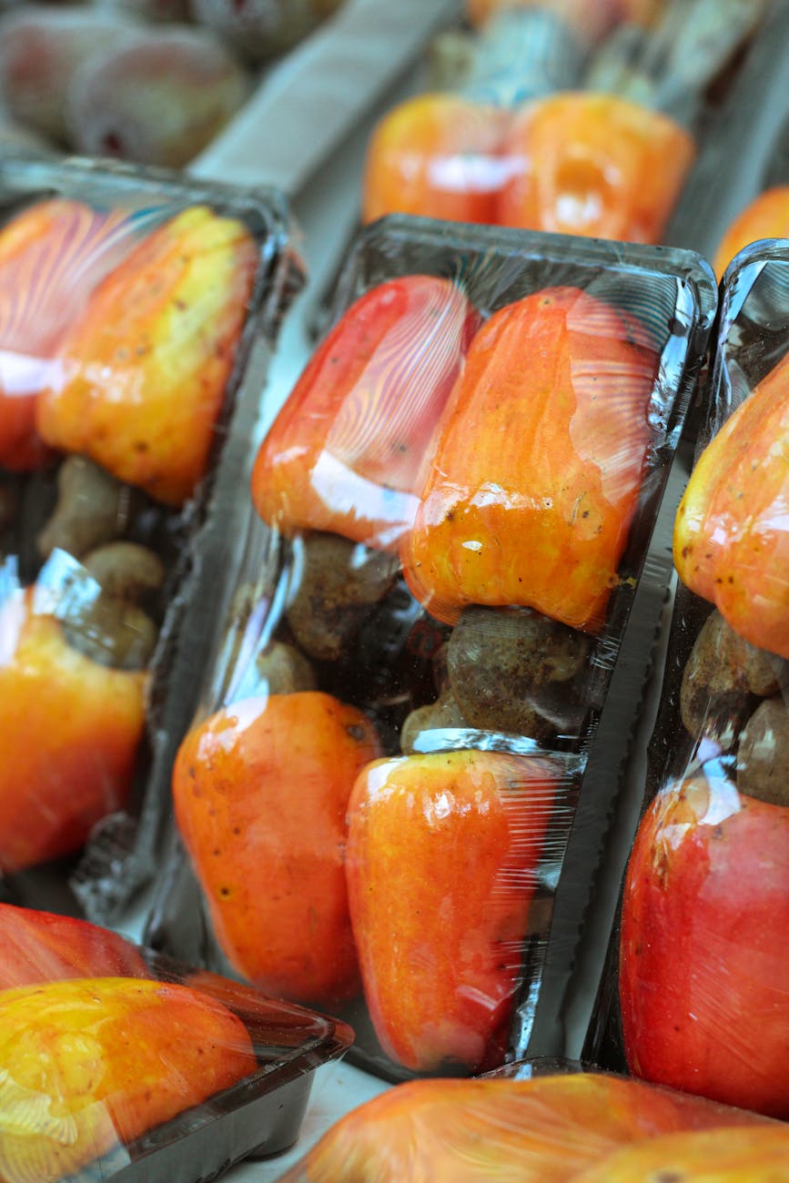 packaged cashew fruits in market display