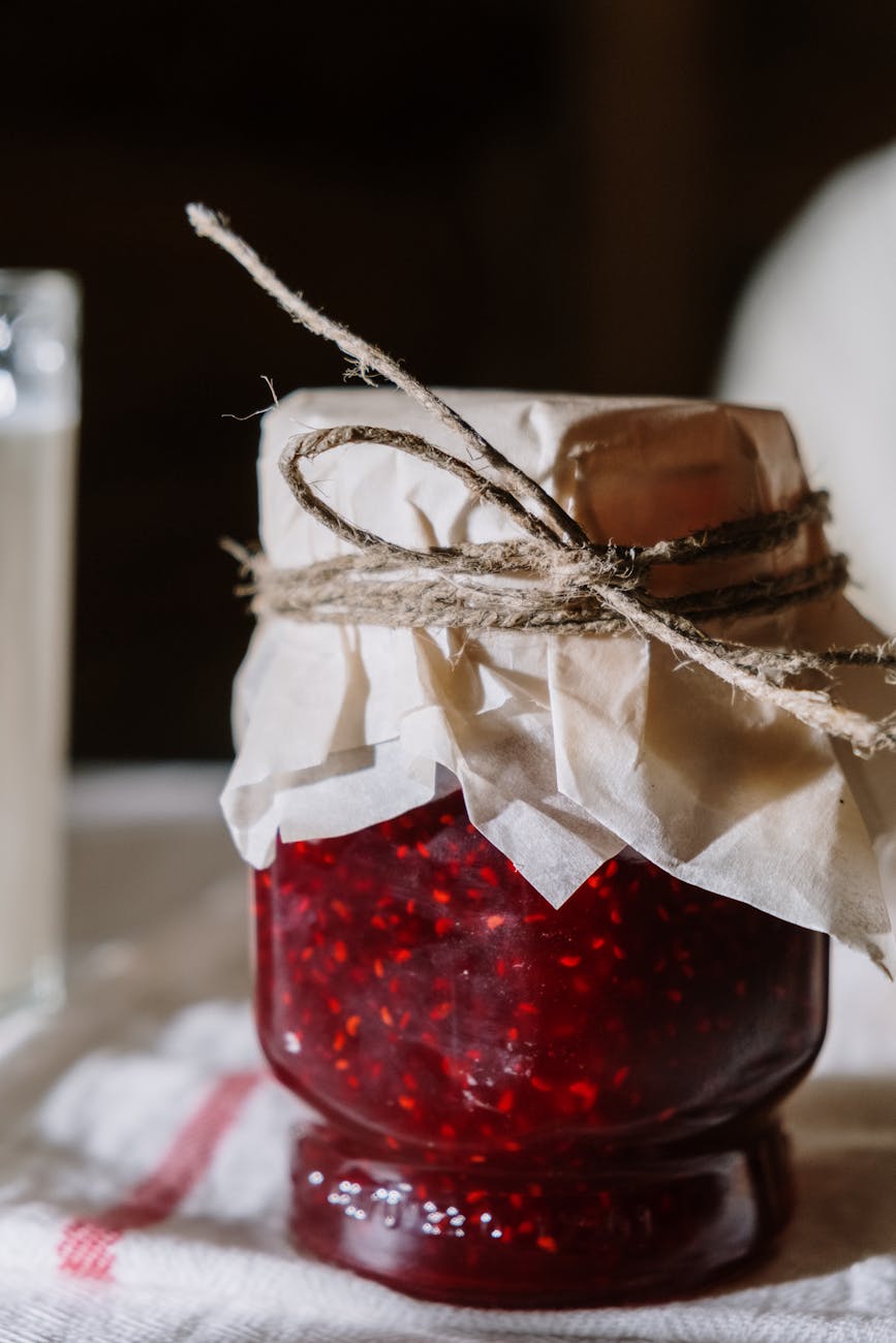glass jar with raspberry jam
