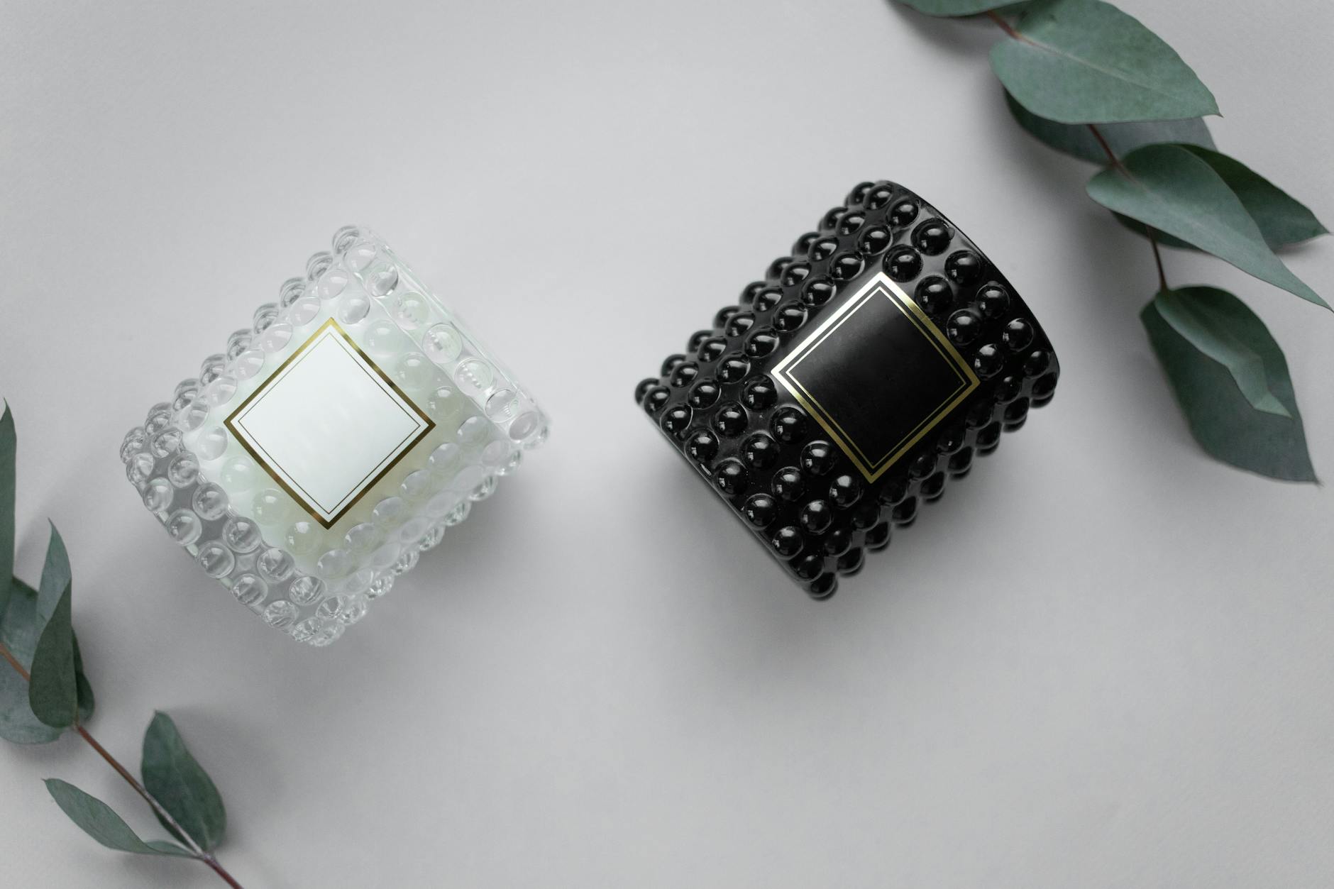 candles on glass containers